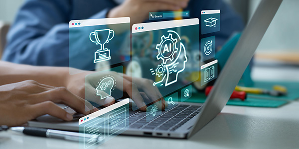 A person typing on a laptop with holographic icons of AI, education, and achievement floating above the keyboard.